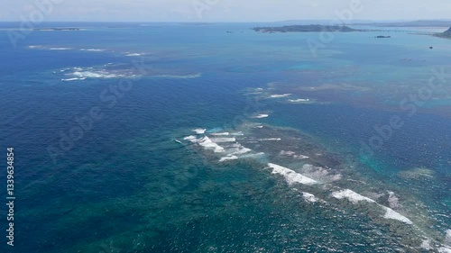 Aerial drone shots of waves hitting the reef, okinawa japan 