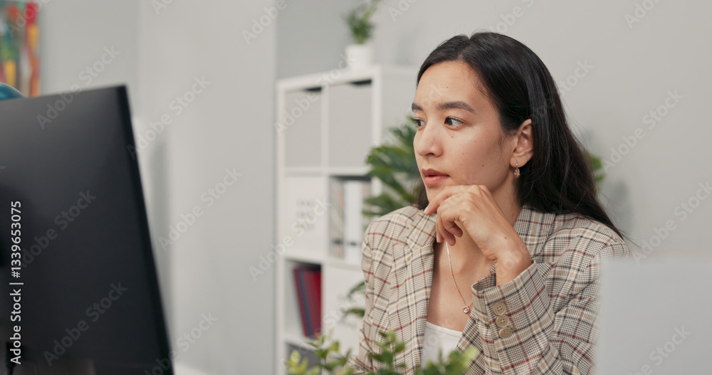 A focused pretty woman with long brown hair wearing a checkered jacket sits at desk in office in front of computer screen, reading news, articles, documents, analyzing propping hand under chin A focused pretty woman with long brown hair wearing a checkered jacket sits at desk in office in front of computer screen, reading news, articles, documents, analyzing propping hand under chin