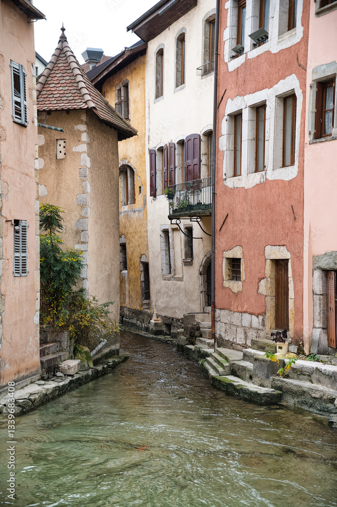 A Breathtaking View of Annecy’s Picturesque Houses, Nestled Along the Tranquil Flowing Waters, Showcasing the Town’s Unique Charm and Timeless Beauty A Breathtaking View of Annecy’s Picturesque Houses, Nestled Along the Tranquil Flowing Waters, Showcasing the Town’s Unique Charm and Timeless Beauty