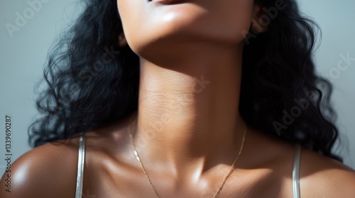 Portrait of a confident woman with vitiligo showcasing her natural beauty through artistic makeup under soft lighting