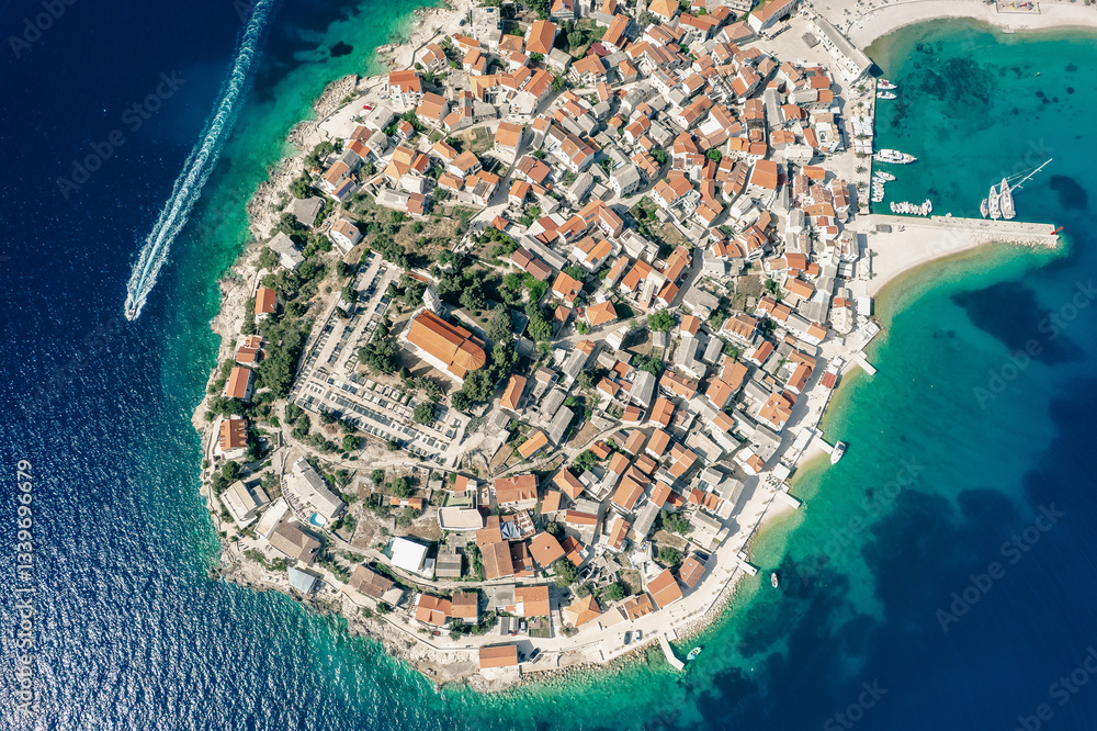 Croatia. Scenic town of Primosten peninsula aerial view, turquoise archipelago