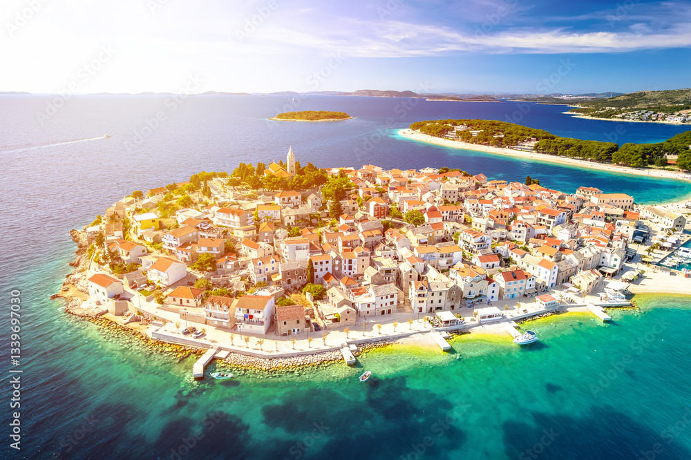 Croatia. Scenic town and beaches of Primosten aerial panoramic sun haze view