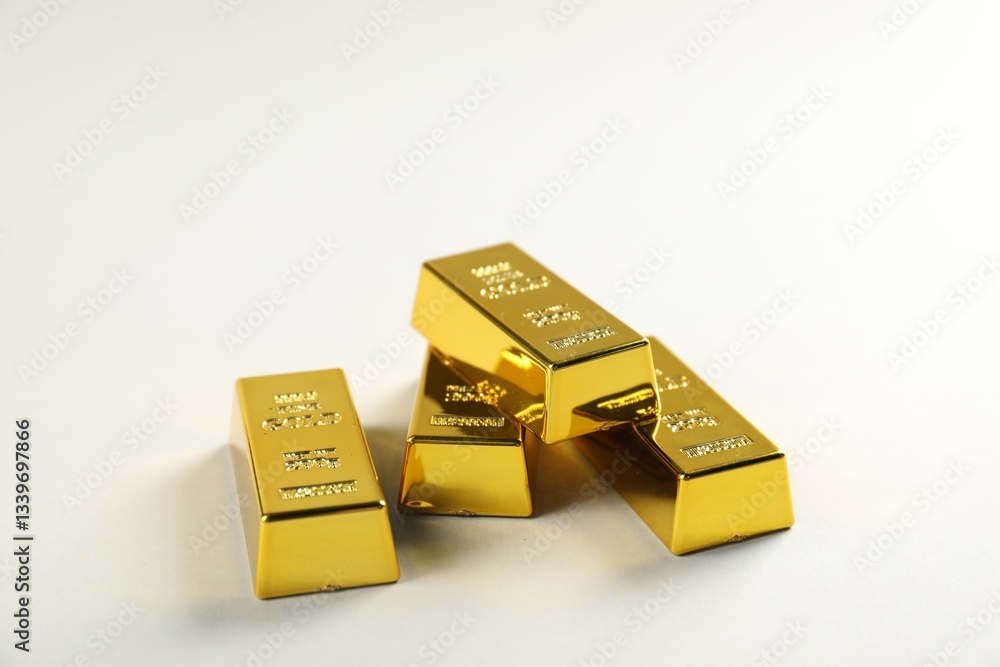 Shiny gold bars on light background, closeup Shiny gold bars on light background, closeup