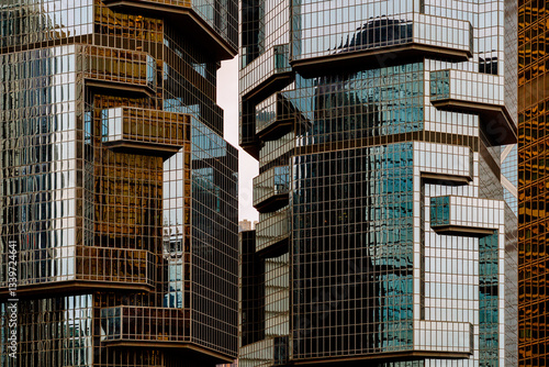 Modern glass buildings reflecting sunlight in Hong Kong photo