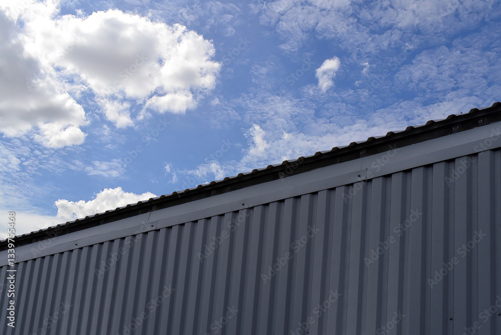 A building with a corrugated metal profile on wall A building with a corrugated metal profile on wall