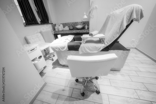 Comfortable pedicure and manicure bed in a modern beauty salon for professional treatments