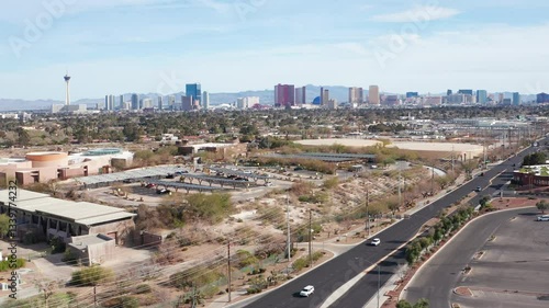 Aerial drone view of Las Vegas city skyline with residential homes and trees 13