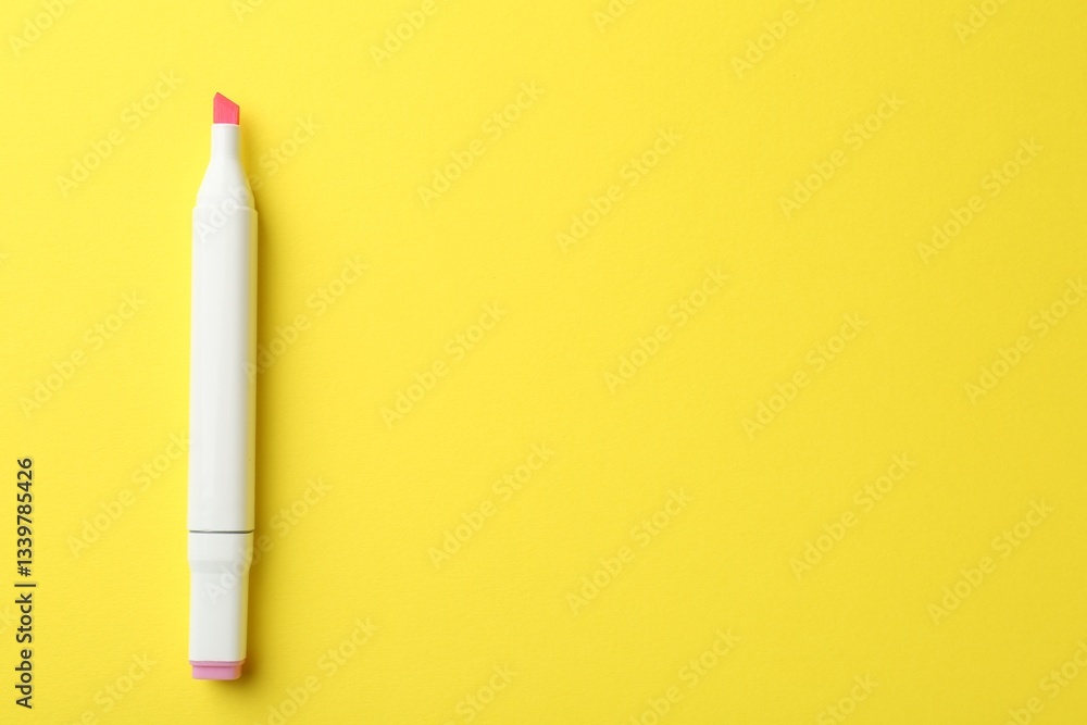 One pink double sided marker on yellow background, top view. Space for text One pink double sided marker on yellow background, top view. Space for text