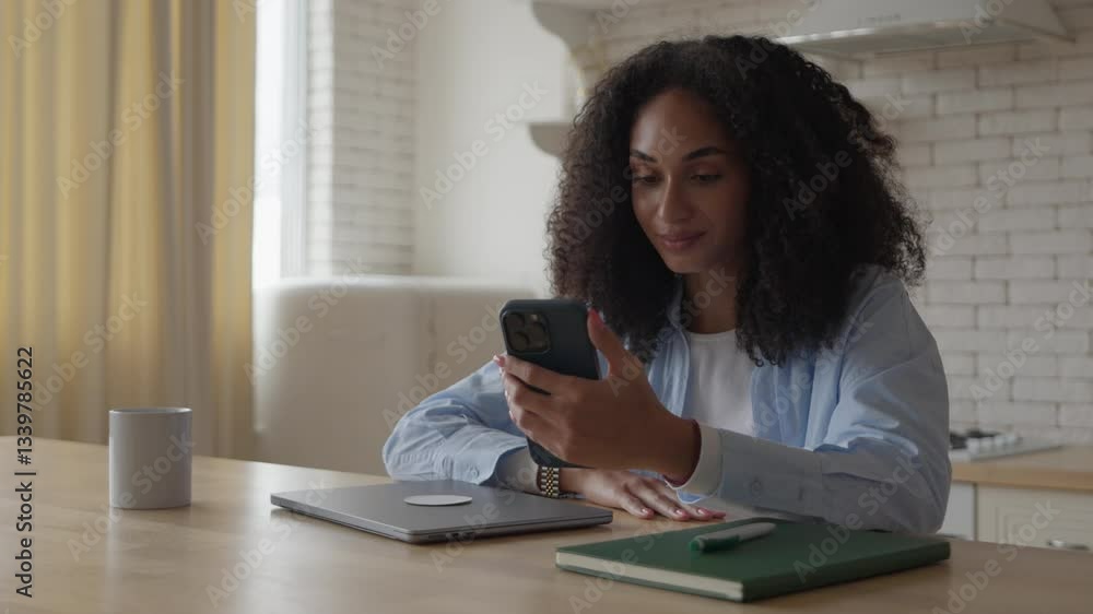 Young Woman On Video Call, Nodding In Agreement While Engaged In Conversation Young Woman On Video Call, Nodding In Agreement While Engaged In Conversation