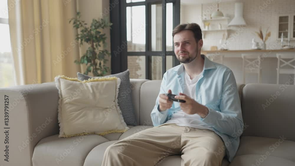 Portrait of Emotional Guy Playing Video Game Using Joystick Having Fun at Home Portrait of Emotional Guy Playing Video Game Using Joystick Having Fun at Home