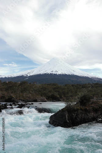 Volcán Osorno en invierno, visto desde Saltos del Petrohue, región de Los Lagos, Chile photo