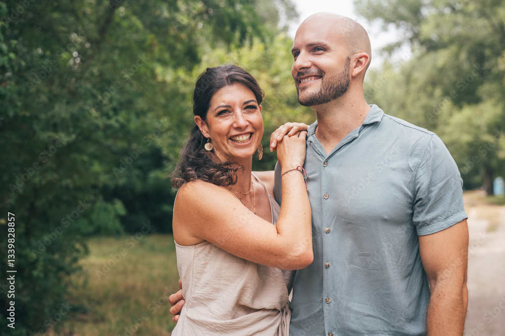 Fototapeta premium Loving couple sharing a joyful moment in nature