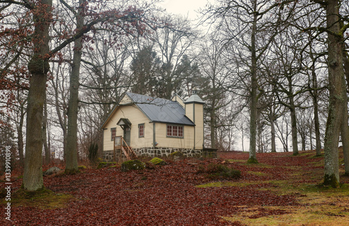 Swedish chapel in a tranquil forest setting. Traditional swedish house. 