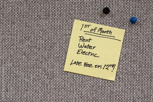 Sticky note reminder for utilities due on the First of the Month