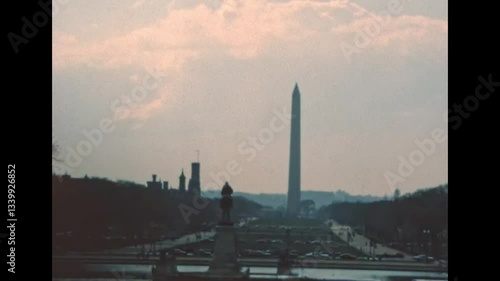 Washington Monument obelisk in the 1980s in Washington DC capital city. Surrounded by American flags, in National Mall park of the United States. Historical archival of America in the year 1980.