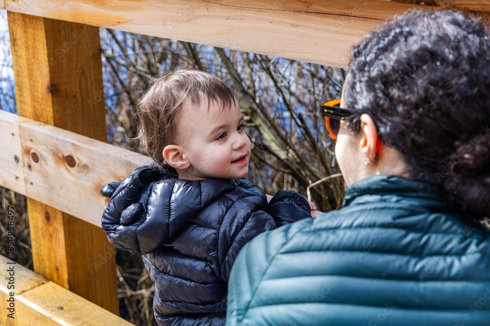 Mother and Child Enjoying Nature on a Wooden Bridge in Burnaby, BC Mother and Child Enjoying Nature on a Wooden Bridge in Burnaby, BC