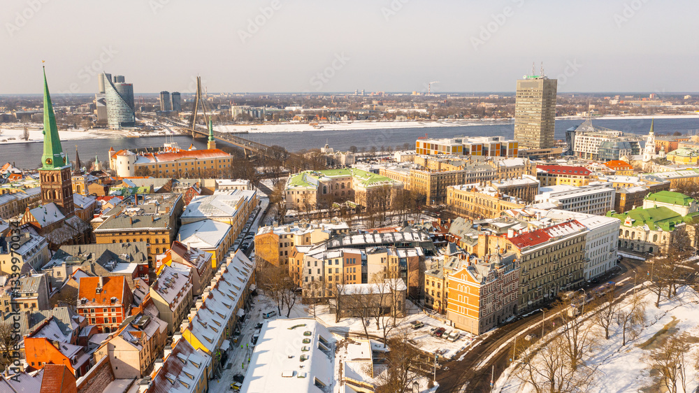 Obraz premium Riga, Latvia, Baltics.Beautiful panoramic aerial 4K video from flying drone to Riga Castle. The Old Town and the Daugava River open up in the background on a beautiful sunny winter day. (series)