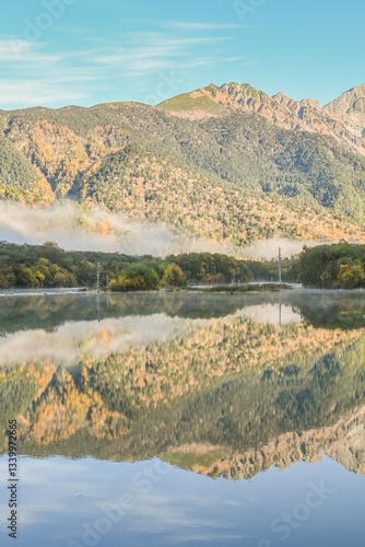 Landscape Views Of Taisho Pond Trail With Autumn Leaves And Morning Fog Along Azusagawa RiverAt Kamikochi, Chubu Sangaku National Park, Nagano, Japan  photo