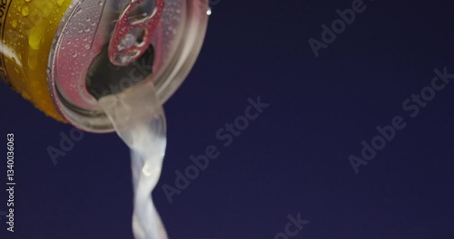 A Refreshing Beverage Being Poured from a Can, Bringing Joy and Celebration in Every Sip