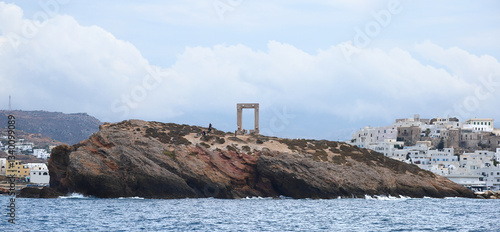 View of The Island of Naxos in Greece with the ruins of the Portara great door on the islet of palatia