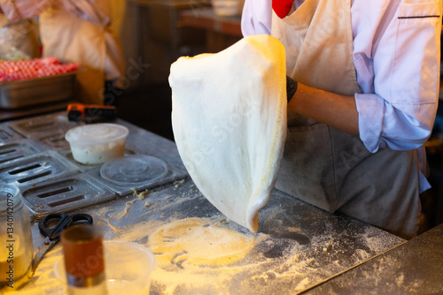 Making process of pizza stella napoletana, a traditional star-shaped pizza from Naples or Napoli, Italy.