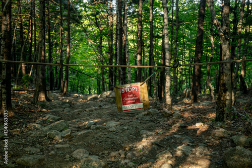 Obraz na płótnie Stop Trail Construction Sign Hangs Over Trail In Forest w salonie