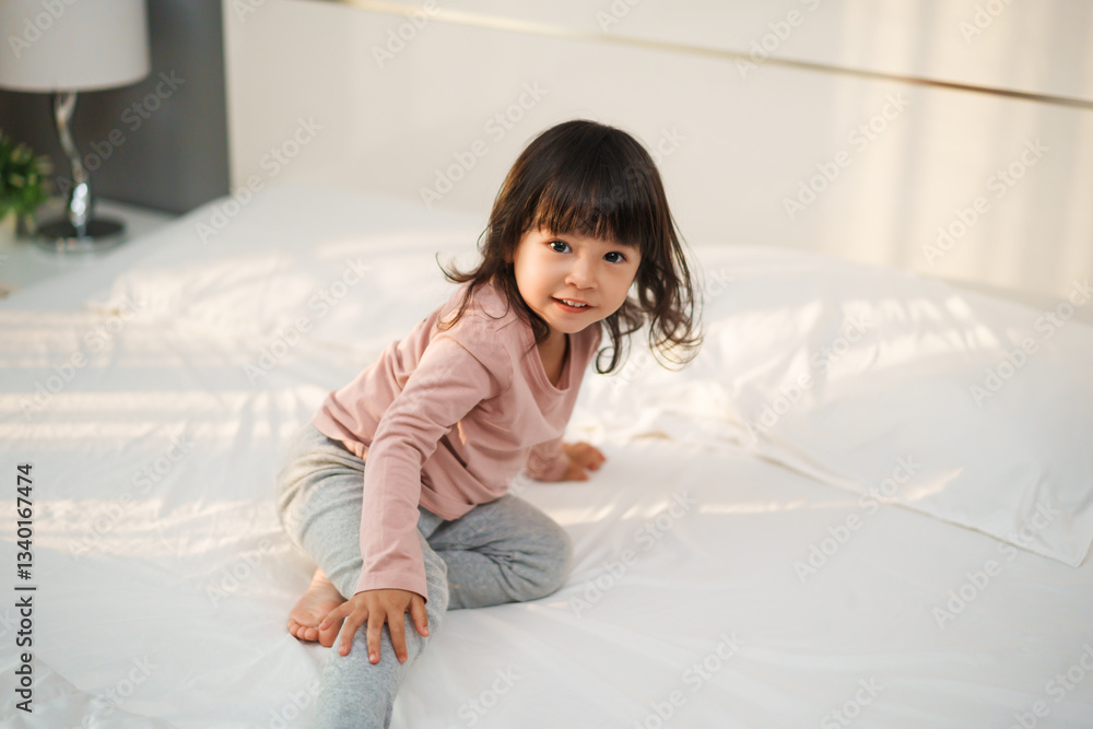 happy toddler girl smilling on bed happy toddler girl smilling on bed