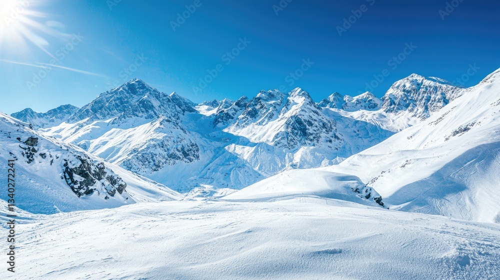 Obraz premium Snow-covered mountains under a clear blue sky.