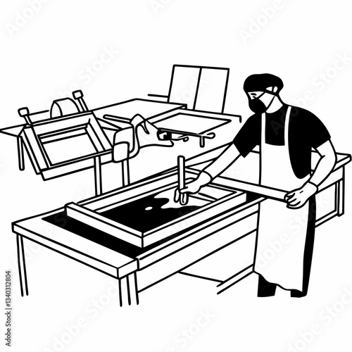 Male worker pressing ink on frame while using the printing machine in a workshop
