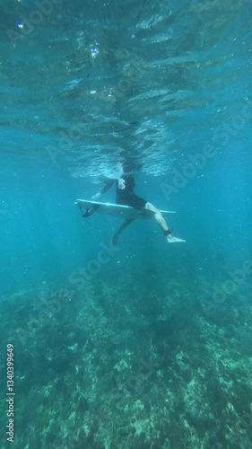 Wallpaper Mural Male surfer waiting a wave in transparent water of Indian Ocean.Slow motion.Vertical video Torontodigital.ca