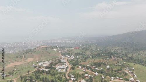 Wallpaper Mural Drone shot the rural town of Kimina Bujumbura Burundi Africa on a warm day with houses on the ground and Lake Tanganyika in the background behind the hills LOG Torontodigital.ca