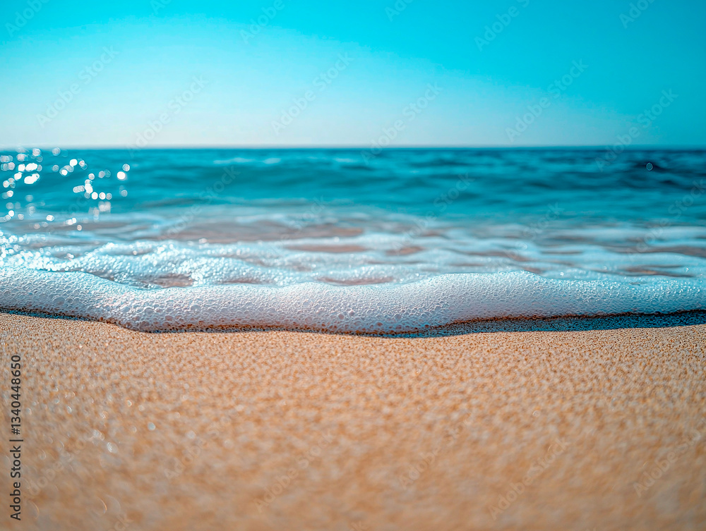 Waves gently roll onto the sandy beach, creating a peaceful and inviting coastal experience. Golden light casts a warm glow across the waters. A perfect spot for relaxation Waves gently roll onto the sandy beach, creating a peaceful and inviting coastal experience. Golden light casts a warm glow across the waters. A perfect spot for relaxation