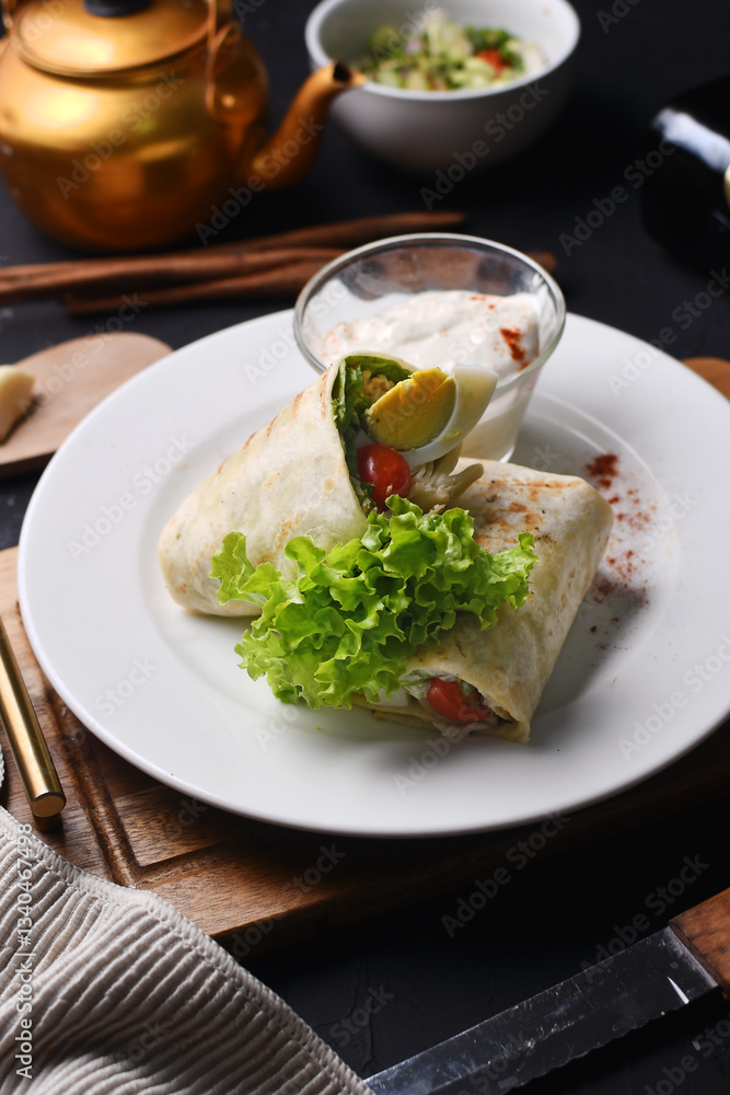 kebab with vegetables filling with mozzarella on a white plate kebab with vegetables filling with mozzarella on a white plate