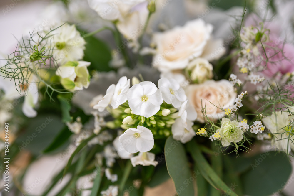 Miniature white flowers in rustic wildflower centerpiece arrangement Miniature white flowers in rustic wildflower centerpiece arrangement