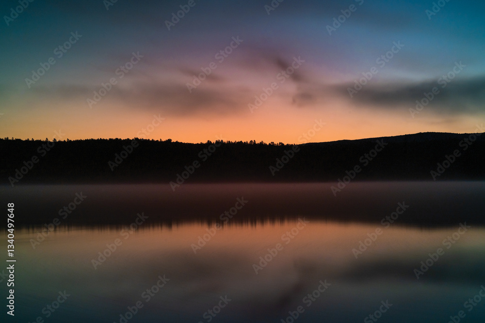 Golden Sunset Reflections on a New England Lake Golden Sunset Reflections on a New England Lake