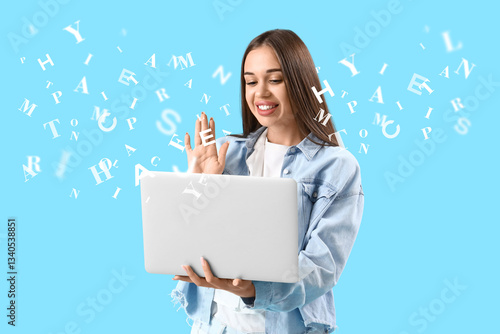 Young woman with laptop vid...