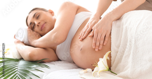 Young pregnant woman having...