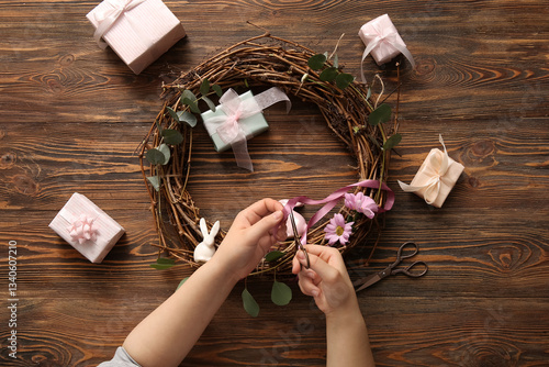 Woman making Easter wreath ...
