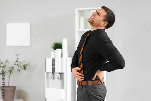Young businessman suffering...