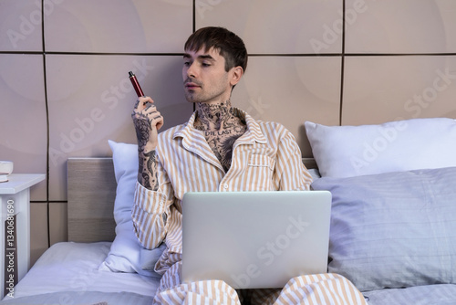Young man in striped pajama...