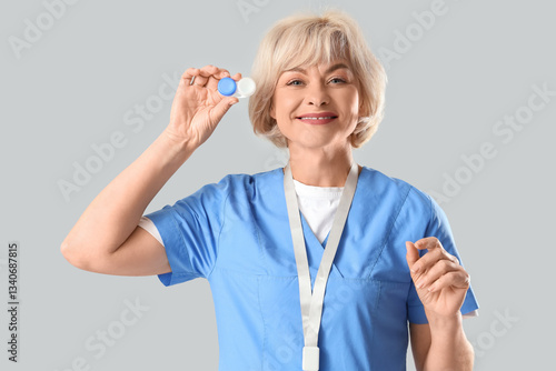 Female oculist with contact...