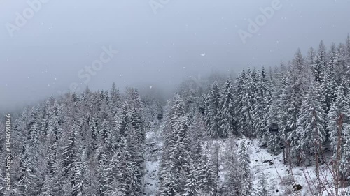 Ski gondolas of Courchevel ski resort in French alps on a snowy day