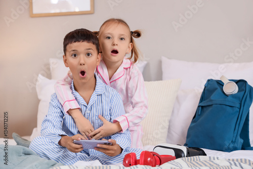 Cute shocked little kids in...