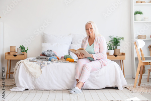 Mature woman with knitting ...