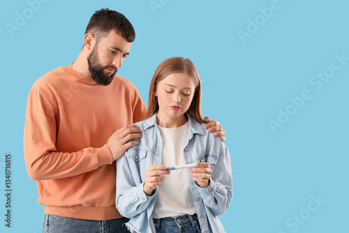 Upset young couple with pre...
