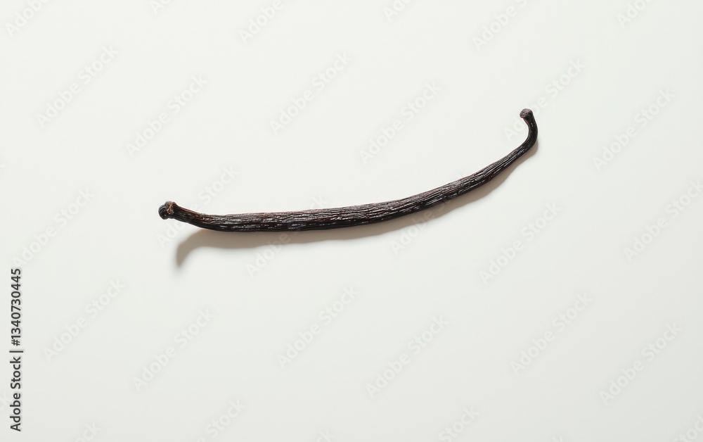 Fototapeta premium Single Dried Vanilla Bean Pod on White Background
