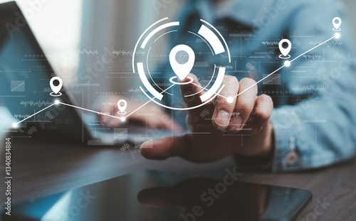 Man using laptop with virtual world and model map with location point , GPS app, icon Travel maps and find places in the online system, all screen graphics are generated,Searching for travel.