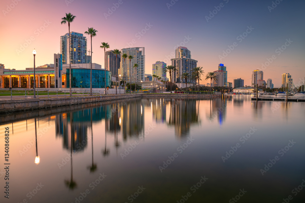 St. Petersburg, Florida, USA. Cityscape image of St. Petersburg, Florida with reflection of the city skyline in the water at beautiful sunset.