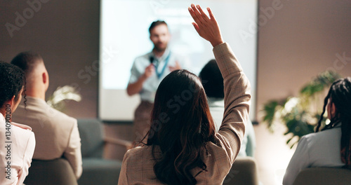 Business people, seminar and convention with audience, question and interaction for feedback or engagement. Group, speaker and back of employee with hand raised for proposal or speech at presentation