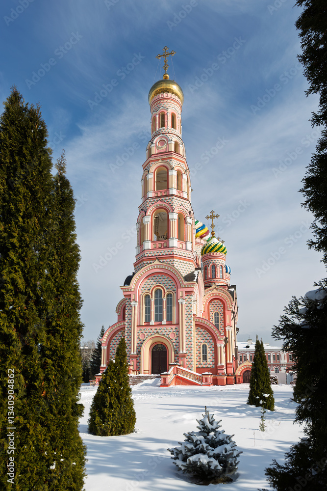 Bell tower of the Ascension Cathedral on the territory of the Tambov Ascension Convent. City of Tambov, Tambov Oblast, Russia. Winter view of the tall multi-colored bell tower. Architectural landmark.